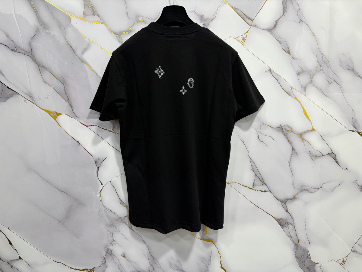 Back view of T-SHIRT LV (RICAMO) displayed against a marble background.