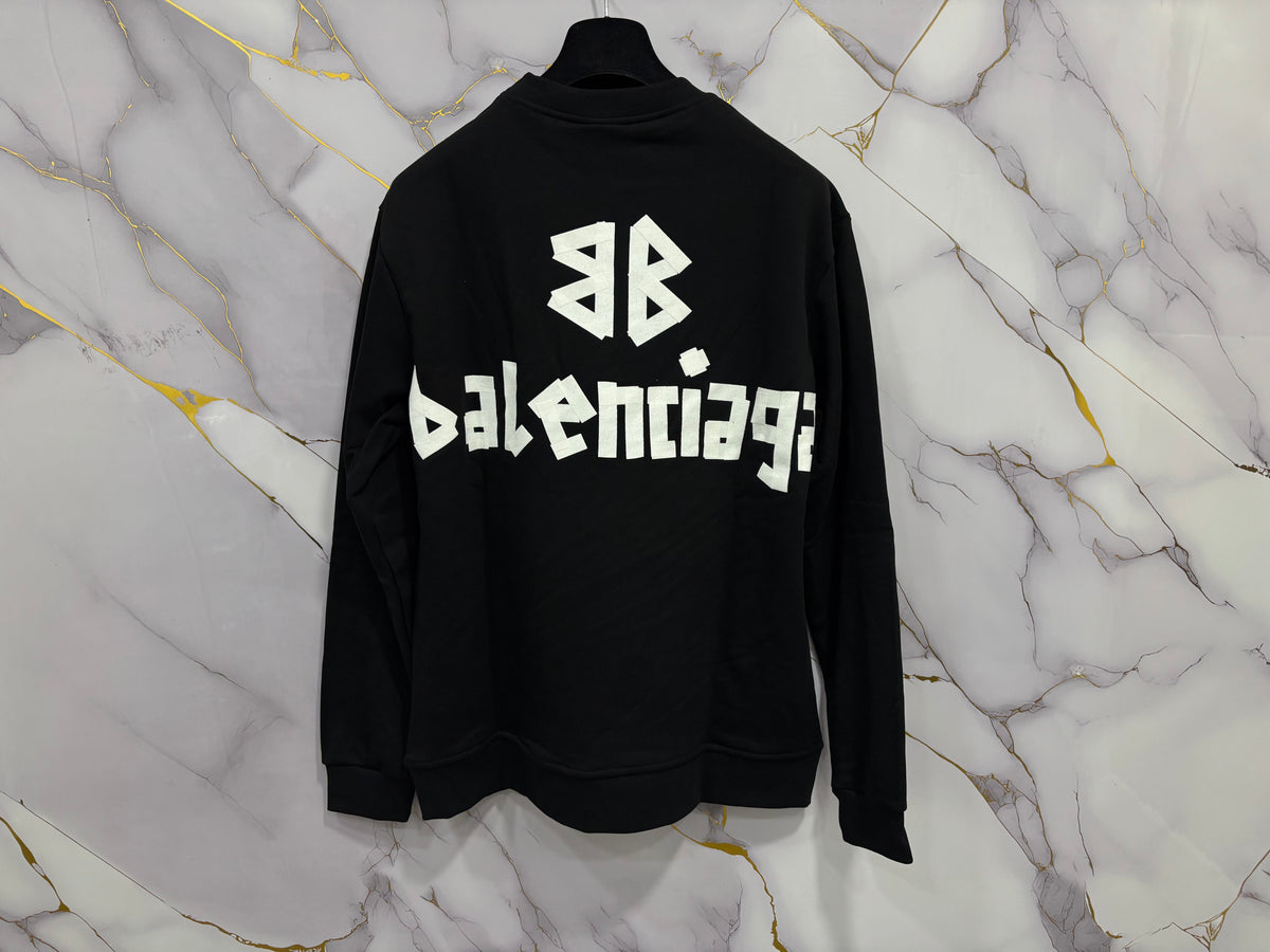 FELPA BALENCIAGA SCOCH displayed on a marble background, showcasing the iconic Balenciaga branding.