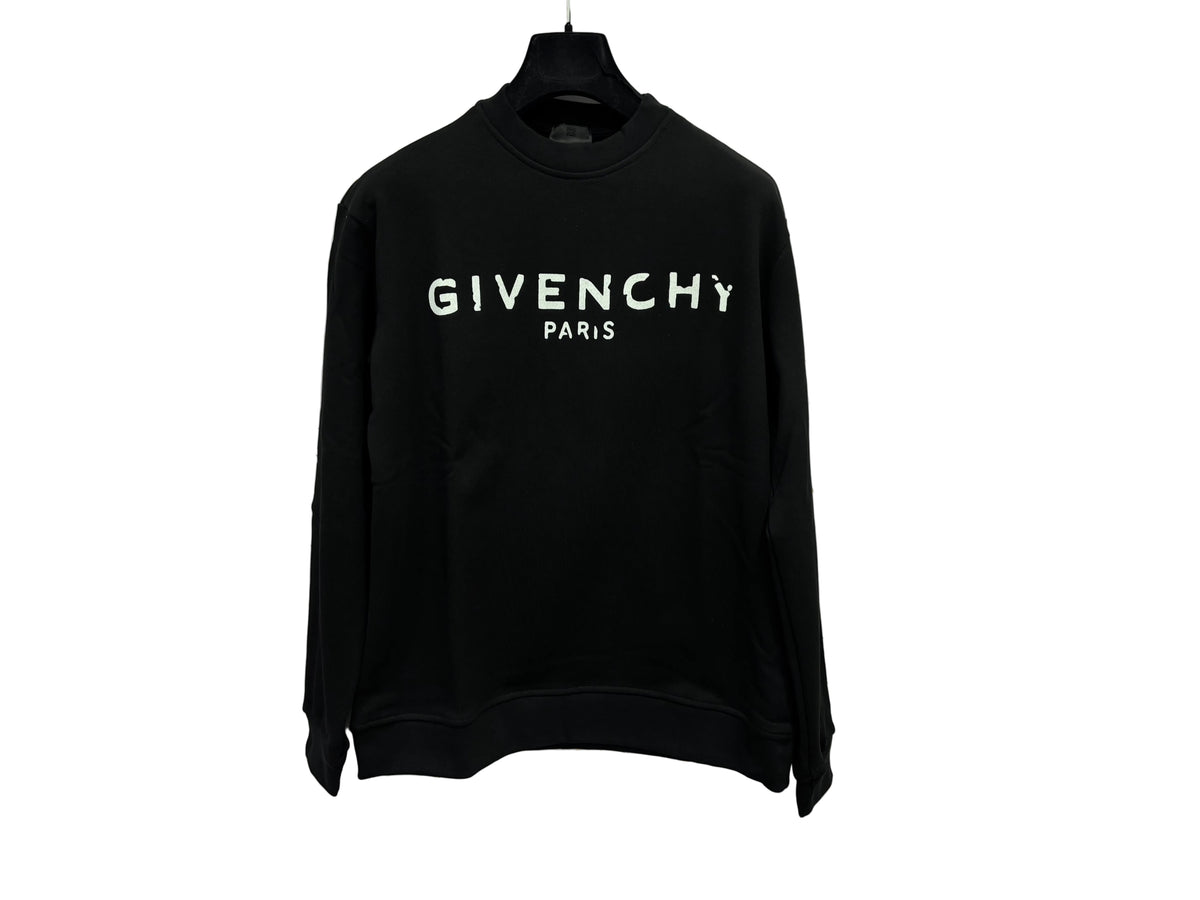 FELPA GIVENCHY CLASSIC displayed on a hanger against a marble background, featuring bold Givenchy Paris logo.