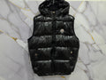 Stylish SMANICATO MONCLER vest in glossy black, perfect for layering and winter outfits.